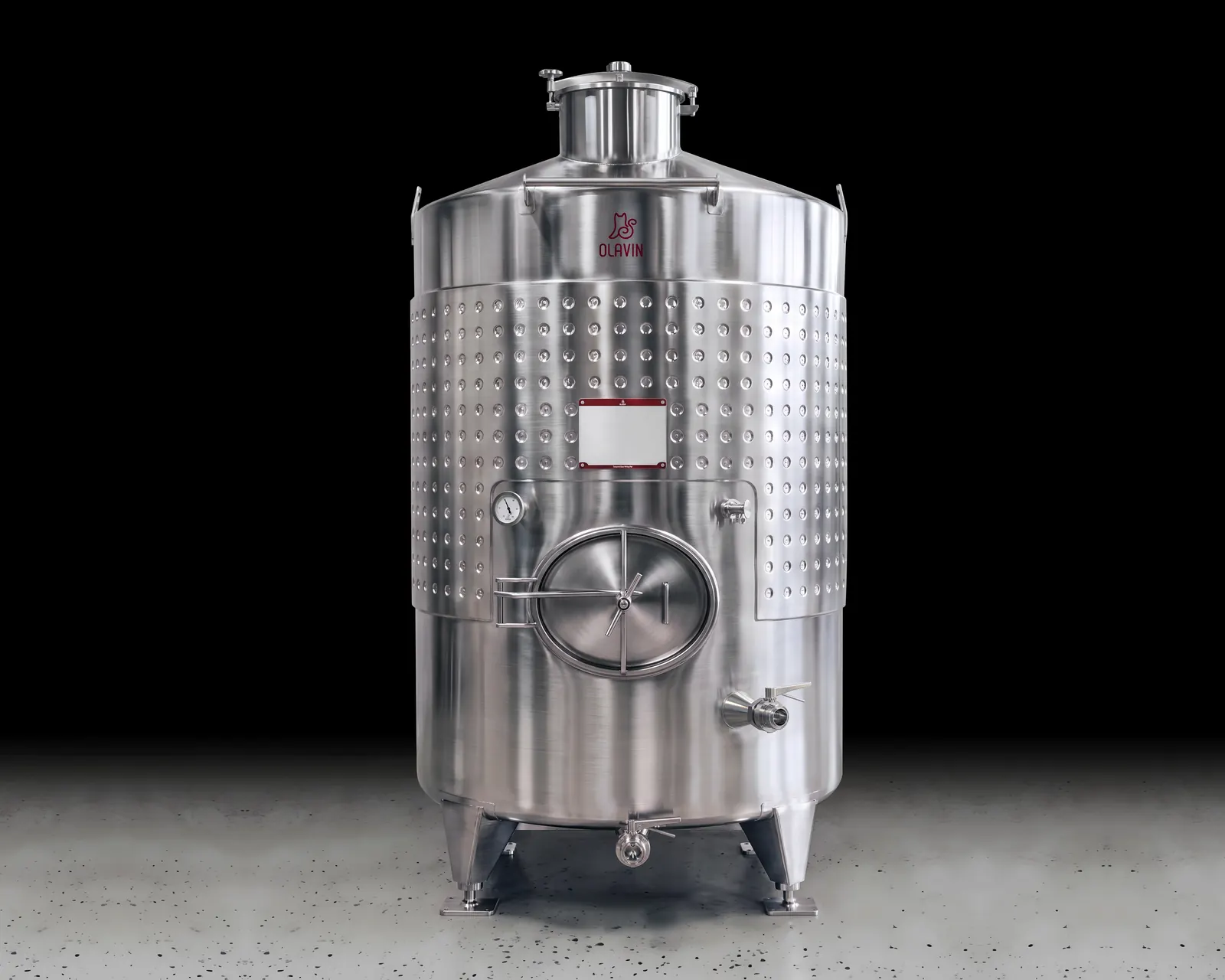 A single Olavin Round Tank: a dimple-jacketed storage tank with a coned top, a large round side manway and a dished bottom on three legs